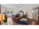 This main bedroom boasts a ceiling fan, hardwood floors, and a tufted headboard at 3441 Sherrod Sw Dr, Marietta, GA 30060