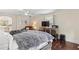 This spacious main bedroom features a TV, armchair and hardwood floors at 3441 Sherrod Sw Dr, Marietta, GA 30060