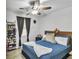 Bedroom featuring a bed, a window with curtains, and a shoe rack for storage at 3819 Shane Ct, Ellenwood, GA 30294