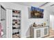 Bedroom featuring a walk-in closet and a wall-mounted TV for entertainment at 3819 Shane Ct, Ellenwood, GA 30294