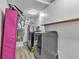 Spacious laundry room featuring modern appliances, white cabinets, and updated utilities at 3819 Shane Ct, Ellenwood, GA 30294