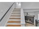 Staircase leading upstairs to a fireplace and second floor hallway at 3819 Shane Ct, Ellenwood, GA 30294