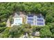 Aerial view of community pool and tennis courts surrounded by mature trees at 435 Chantenay Pl, Alpharetta, GA 30022