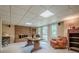 Finished basement featuring a brick fireplace, comfortable chair, and bright lighting at 435 Chantenay Pl, Alpharetta, GA 30022