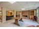 Finished basement with large table and fireplace at 435 Chantenay Pl, Alpharetta, GA 30022