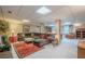 Finished basement with large sectional, rug, and versatile living space at 435 Chantenay Pl, Alpharetta, GA 30022