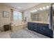 Bright bathroom with double vanity, soaking tub, and separate shower at 435 Chantenay Pl, Alpharetta, GA 30022