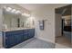 Spacious bathroom with double vanity, large mirror, and tile flooring at 435 Chantenay Pl, Alpharetta, GA 30022
