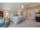 Spacious bedroom featuring a ceiling fan, plush carpet, and comfortable furnishings at 435 Chantenay Pl, Alpharetta, GA 30022