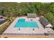 Aerial view of community pool with lounge chairs and mature trees at 435 Chantenay Pl, Alpharetta, GA 30022