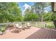 Outdoor deck showcases wicker chairs and a table, providing a cozy setting to enjoy the outdoors at 435 Chantenay Pl, Alpharetta, GA 30022
