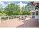 Outdoor deck features a dining table and chairs, offering a delightful space for relaxation and outdoor entertaining at 435 Chantenay Pl, Alpharetta, GA 30022