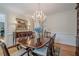 Dining room with a chandelier, large table, and decorative sideboard at 435 Chantenay Pl, Alpharetta, GA 30022