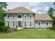 Elegant two-story house with a well-kept lawn, large windows, and a welcoming front entrance at 435 Chantenay Pl, Alpharetta, GA 30022