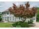 Stately two-story home featuring mature landscaping, a long driveway, and a side-entry garage at 435 Chantenay Pl, Alpharetta, GA 30022