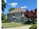 Charming two-story home with a well-manicured lawn and mature landscaping in a desirable neighborhood at 435 Chantenay Pl, Alpharetta, GA 30022