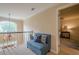 Hallway features a seating nook and view into a main bedroom suite at 435 Chantenay Pl, Alpharetta, GA 30022