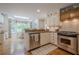 Bright kitchen with stainless steel appliances and a sunlit dining area at 435 Chantenay Pl, Alpharetta, GA 30022