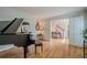 Elegant living room showcasing a grand piano and an inviting entryway at 435 Chantenay Pl, Alpharetta, GA 30022
