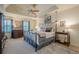 Main bedroom suite showcases a tray ceiling, ceiling fan, natural light, and neutral decor at 435 Chantenay Pl, Alpharetta, GA 30022