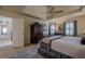 Spacious bedroom features tray ceiling, ceiling fan, and access to hallway at 435 Chantenay Pl, Alpharetta, GA 30022