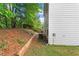 Backyard featuring a grassy lawn with wood privacy fence at 10786 Wheeler Trce, Hampton, GA 30228