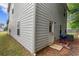 A view of the backyard with siding, window, and door at 10786 Wheeler Trce, Hampton, GA 30228