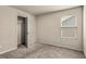 Bedroom featuring a window, a closet, neutral walls, and plush carpeting at 10786 Wheeler Trce, Hampton, GA 30228