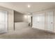 Bonus room featuring neutral walls, plush carpeting, two closets, and access to additional rooms at 10786 Wheeler Trce, Hampton, GA 30228