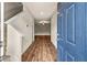 Inviting foyer with hardwood floors leading into a spacious living area at 10786 Wheeler Trce, Hampton, GA 30228