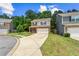 Comfortable home on a grassy lot, featuring a long driveway leading to a two-car garage at 10786 Wheeler Trce, Hampton, GA 30228