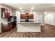 A kitchen featuring wooden cabinets, granite countertops, and stainless-steel appliances at 10786 Wheeler Trce, Hampton, GA 30228