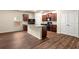 Well-designed kitchen with granite island and stainless steel appliances, great for entertaining at 10786 Wheeler Trce, Hampton, GA 30228