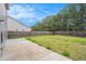 Spacious backyard with a concrete patio and lush green grass at 196 Boulder Run, Hiram, GA 30141