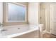 Inviting bathroom features a soaking tub and separate glass-enclosed shower at 196 Boulder Run, Hiram, GA 30141