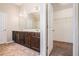 Large bathroom with double vanity, tile floor and a door to a walk-in closet at 196 Boulder Run, Hiram, GA 30141
