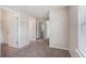 Spacious carpeted bedroom with multiple doors and sunlit window at 196 Boulder Run, Hiram, GA 30141