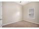 Cozy bedroom offers neutral paint, carpet and a sunlit window at 196 Boulder Run, Hiram, GA 30141