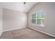 Vaulted bedroom offers natural light and neutral tones at 196 Boulder Run, Hiram, GA 30141