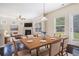Open concept dining room with fireplace and a natural light-filled view at 196 Boulder Run, Hiram, GA 30141