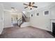 Open concept living room with plush carpet, staircase and neutral paint at 196 Boulder Run, Hiram, GA 30141