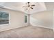 Large primary bedroom featuring tray ceilings, neutral tones, and natural light at 196 Boulder Run, Hiram, GA 30141