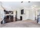 Open-concept living and kitchen area with dark wood floors, a staircase, and neutral paint at 196 Boulder Run, Hiram, GA 30141