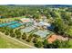 A sprawling community featuring tennis courts, pools, a clubhouse, and a manicured golf course at 250 Chason Wood Way, Roswell, GA 30076