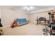 The basement area has neutral colored carpet, a ceiling fan and is being used as a recreational space at 250 Chason Wood Way, Roswell, GA 30076