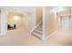 Basement with neutral carpet leads up a set of stairs; plenty of space with storage at 250 Chason Wood Way, Roswell, GA 30076