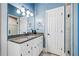 Bathroom with granite countertops, white cabinetry, and tile flooring at 250 Chason Wood Way, Roswell, GA 30076