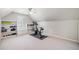 Bonus room with built-in shelving and a vaulted ceiling at 250 Chason Wood Way, Roswell, GA 30076
