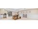 Open concept dining room and kitchenette with tiled flooring, a modern wood dining set and wet bar area at 250 Chason Wood Way, Roswell, GA 30076