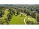 Lush green golf course with a winding cart path surrounded by mature trees at 250 Chason Wood Way, Roswell, GA 30076